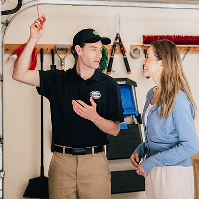 Service worker showing customer garage door