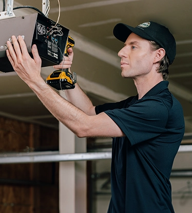 A PDS expert working on a garage door device.